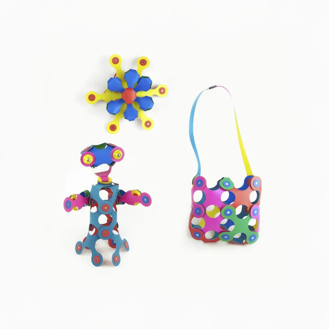 Montessori-inspired multi-color rainbow spectrum folding magnetic quads for open-ended play.