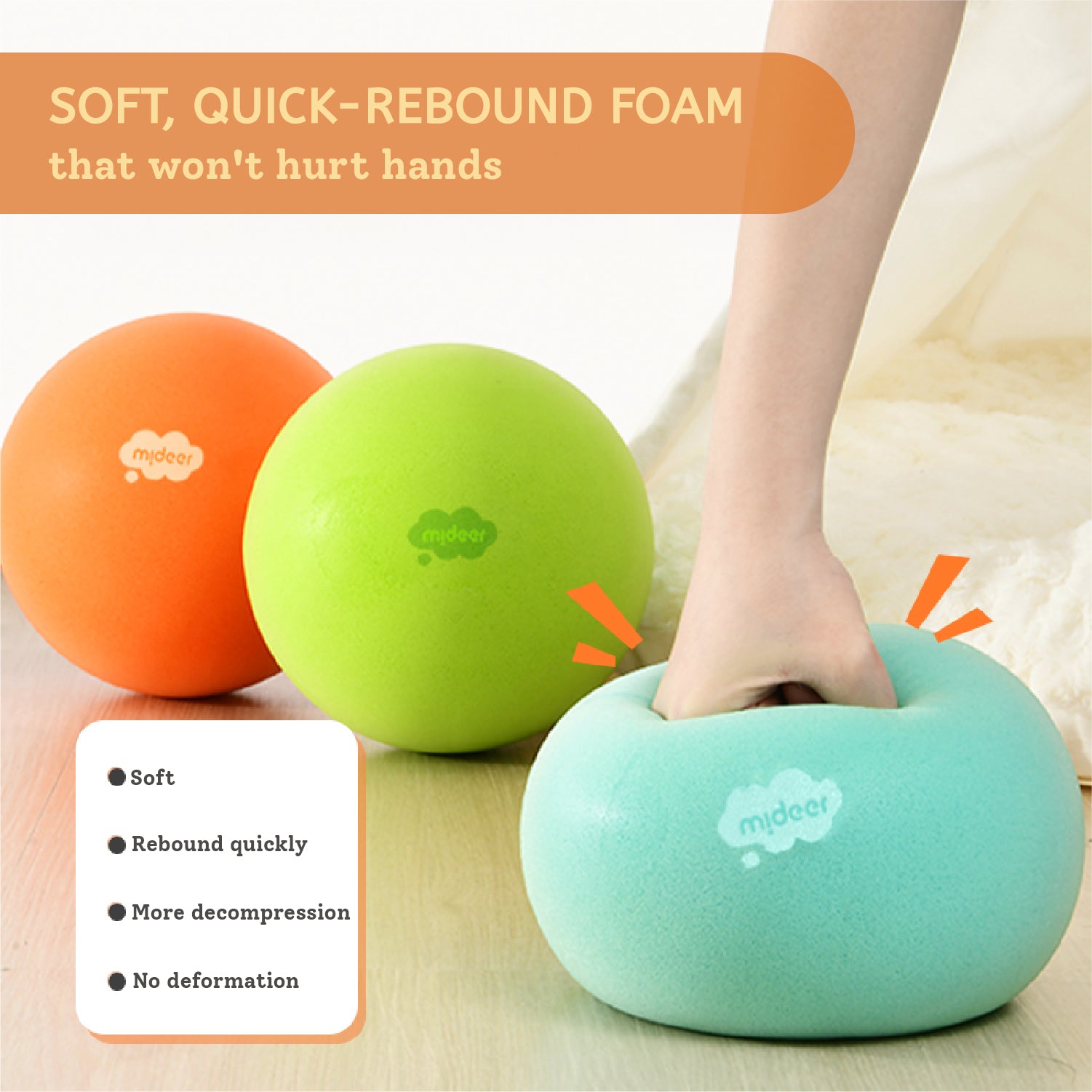 Three soft foam exercise balls in orange, green, and mint blue are shown on a light wood floor, with a person's hand pressing into the mint blue ball. Text overlays describe the product as soft, quick-rebound foam.