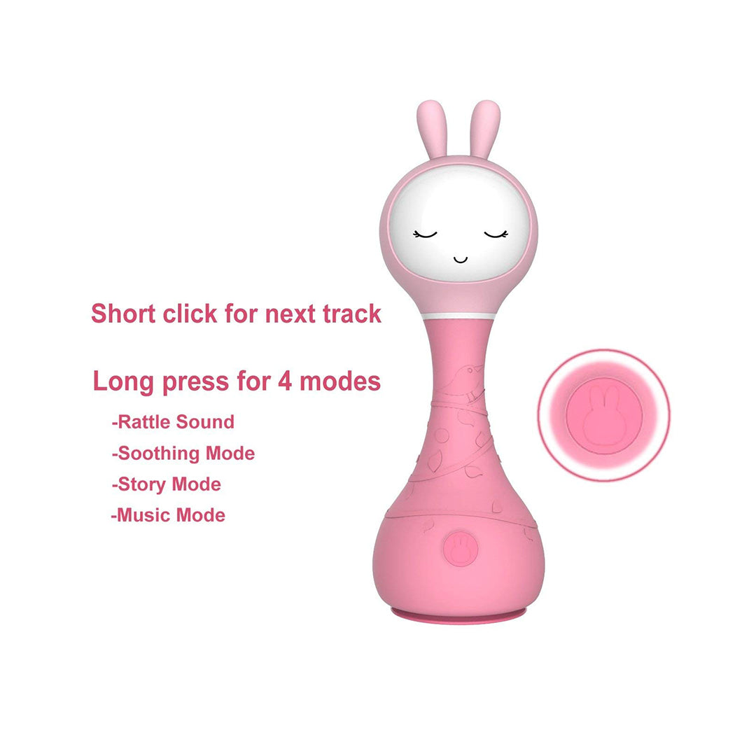 Infant holding pink Alilo rattle to improve hand-eye coordination.

