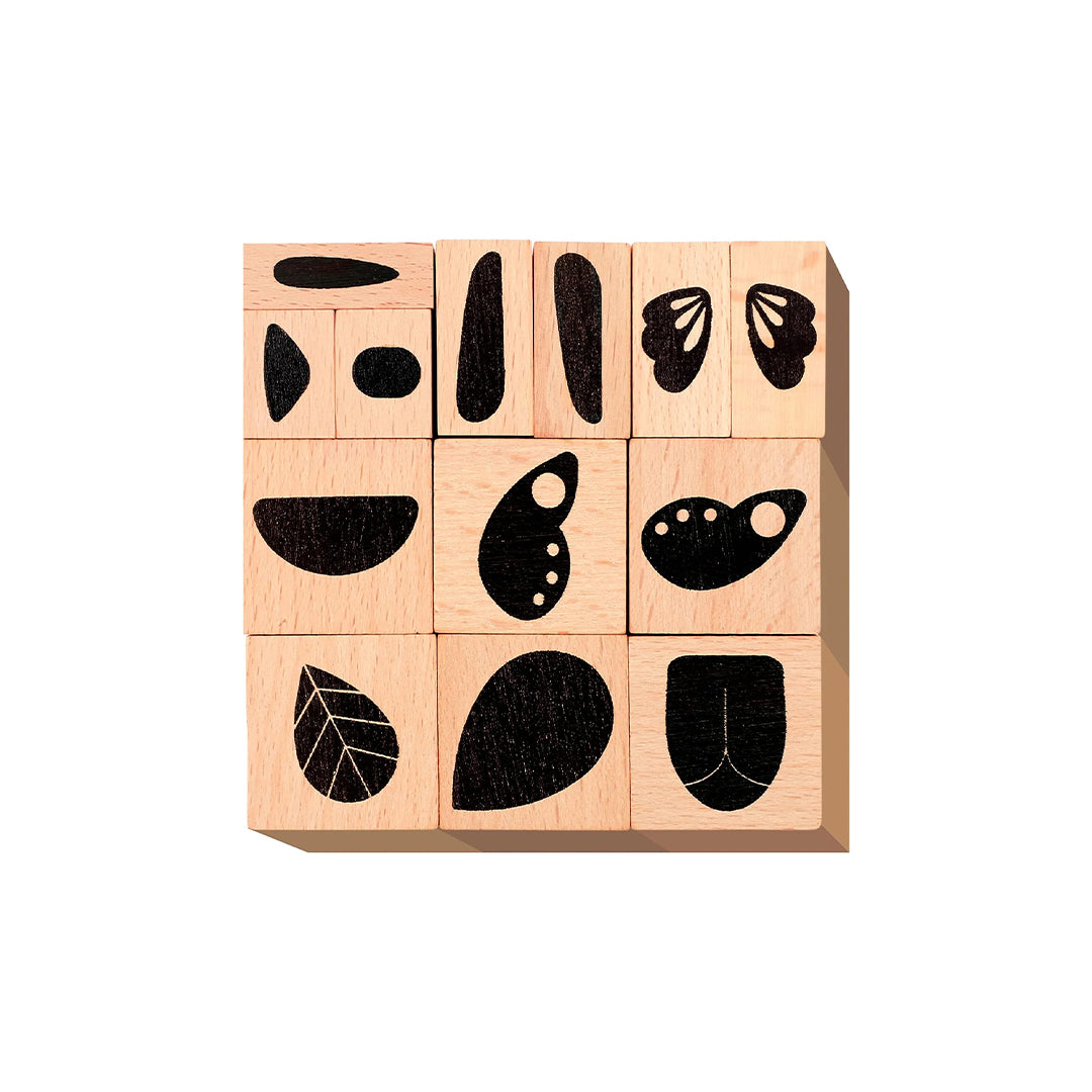 Educational toys for kids featuring 15 wooden stamps for open-ended play.
