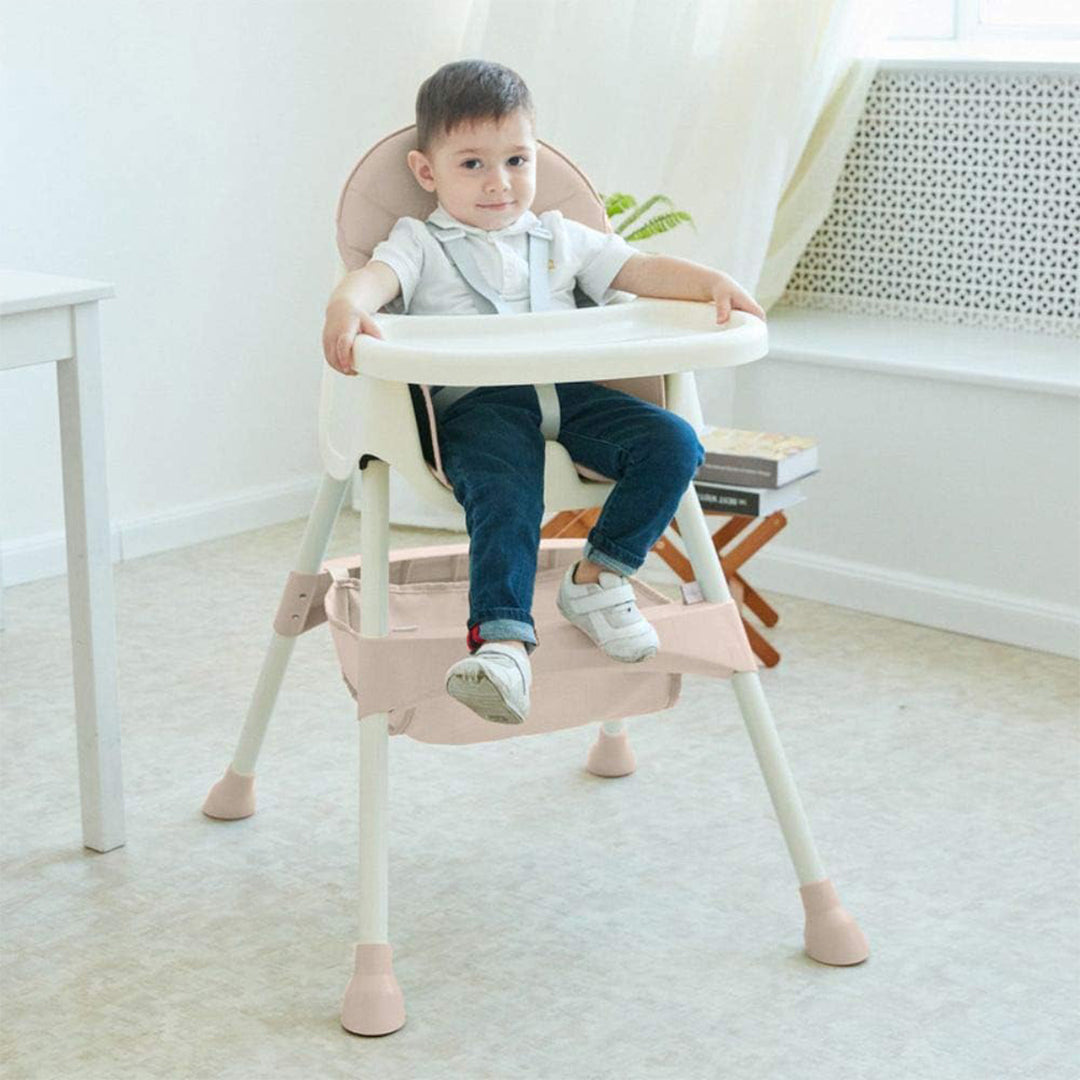 Toddler Sitting in Adjustable Height High Chair with Removable Tray
