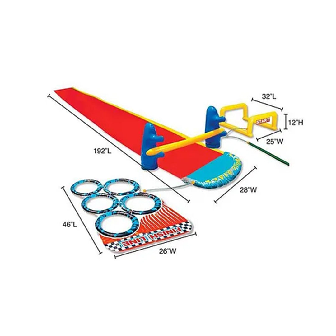 The full setup of the Banzai Aqua Blast Obstacle Course Slide, showing the long blue slide, the yellow hurdle, the tire jump, and the red limbo bar on a green lawn.