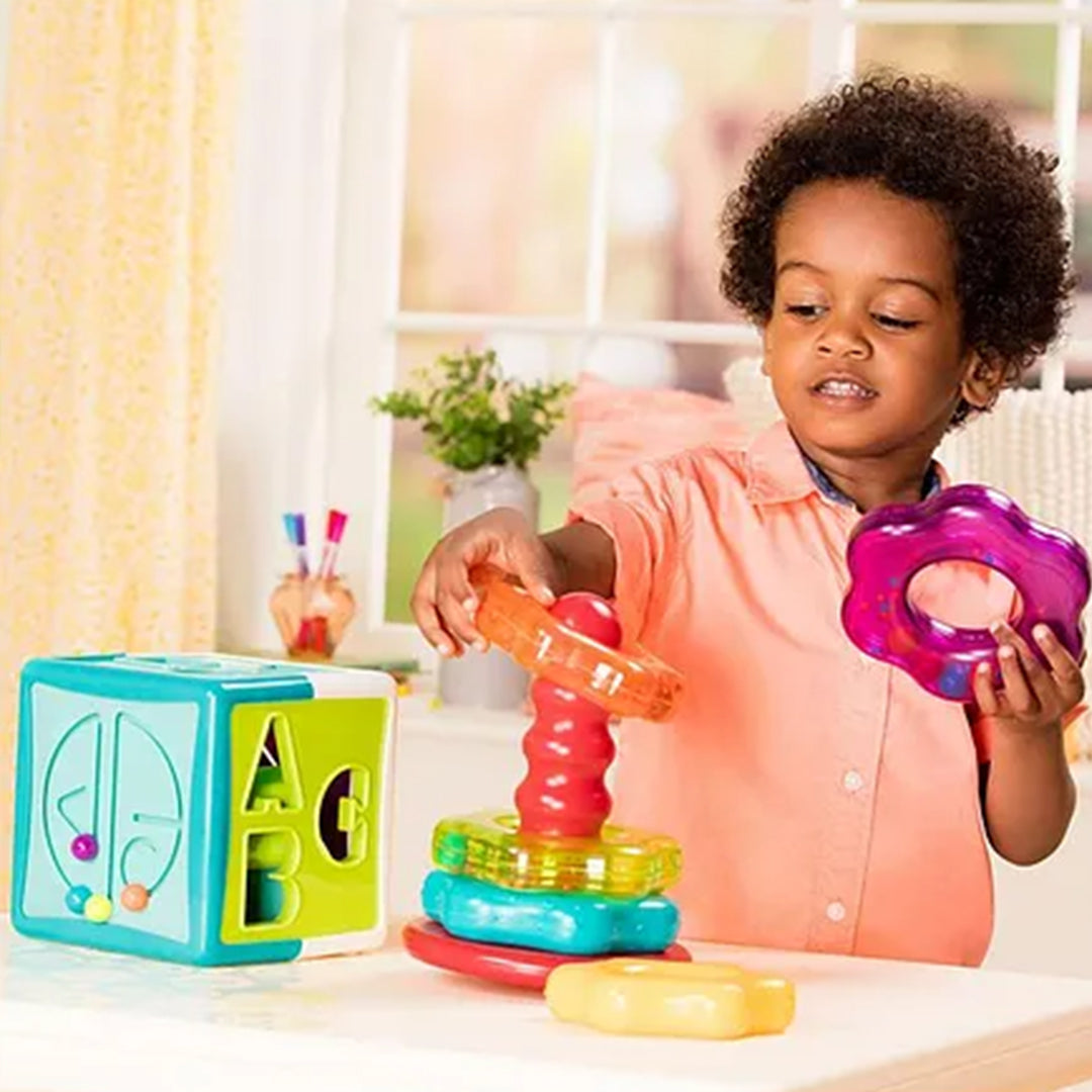 Child playing with the Battat Shape Sorter Cube