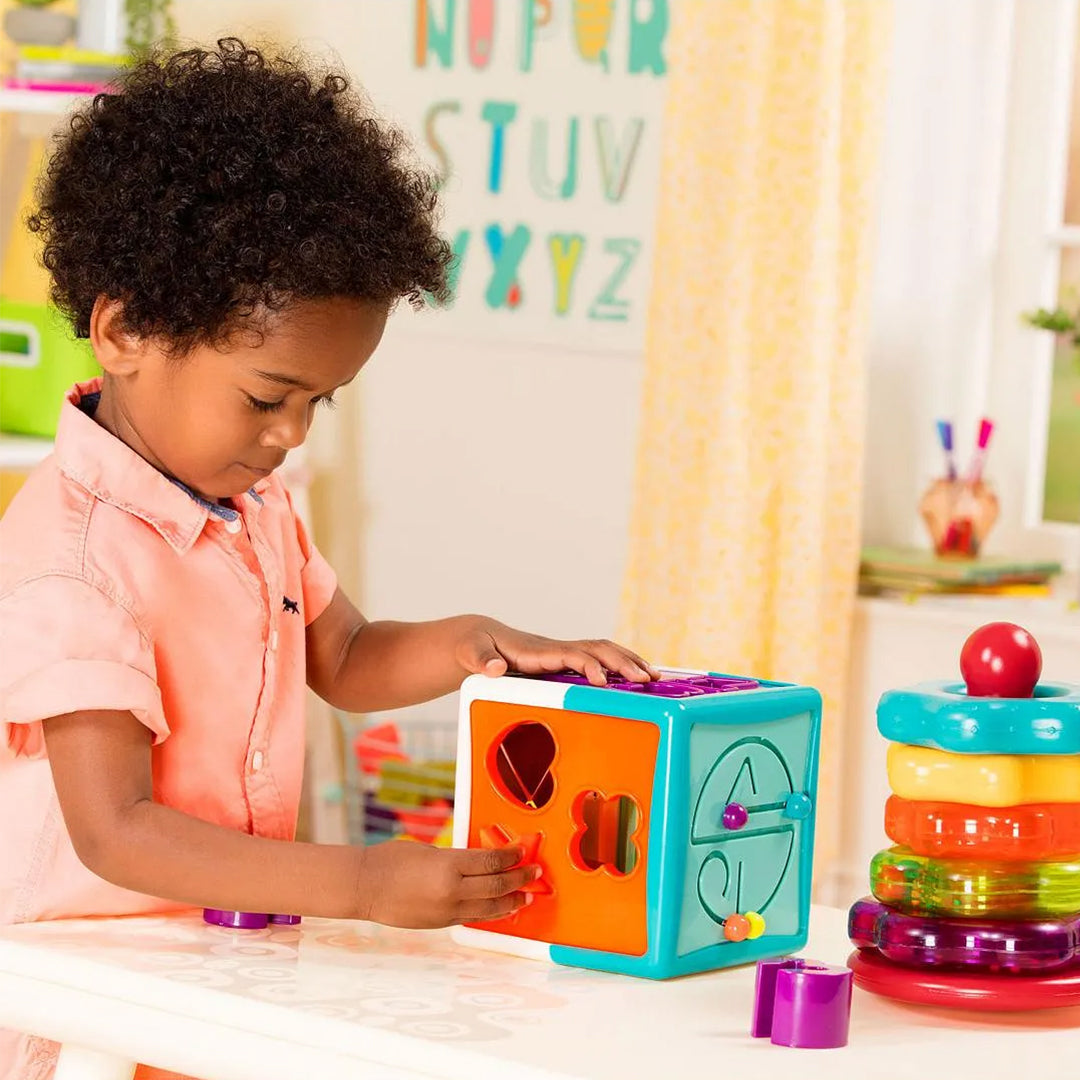 Toddler stacking the Battat Stacking Rings