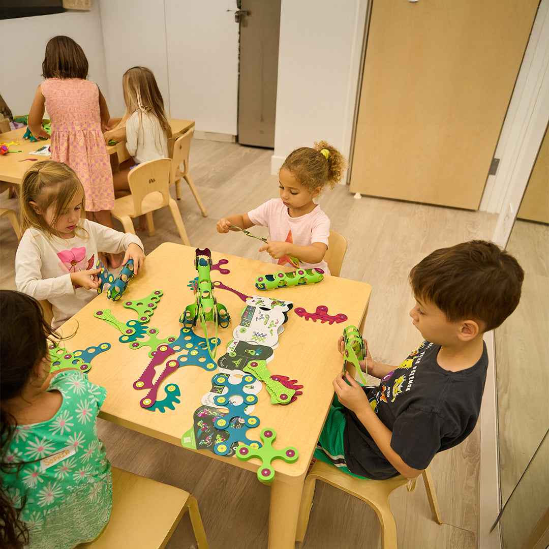 Preschool multi-level modular STEAM magnetic snapping blocks with prehistoric textures and creative activity toys.
