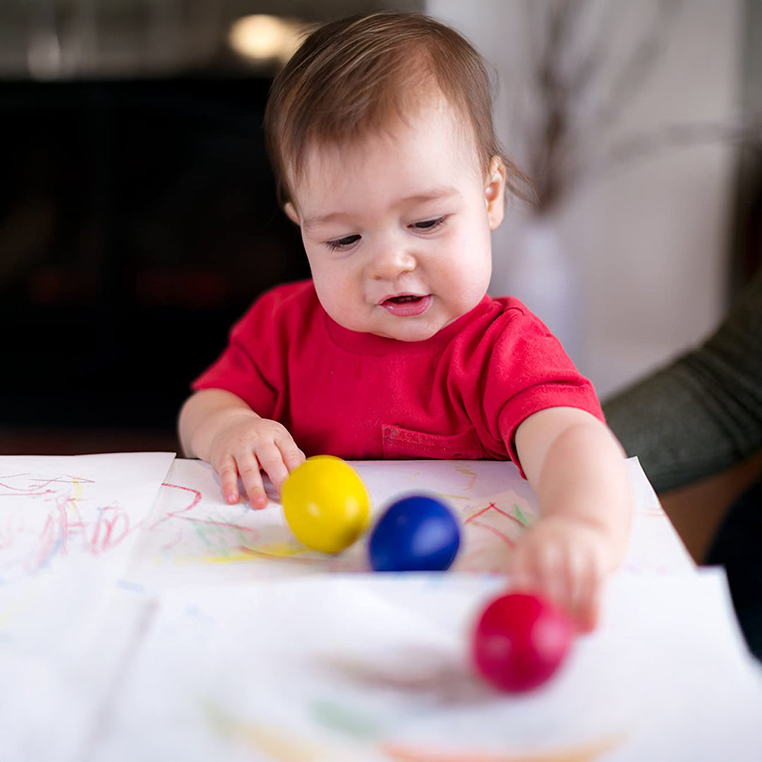 Image of a Child Scribbling with the Palm Grip Crayons
