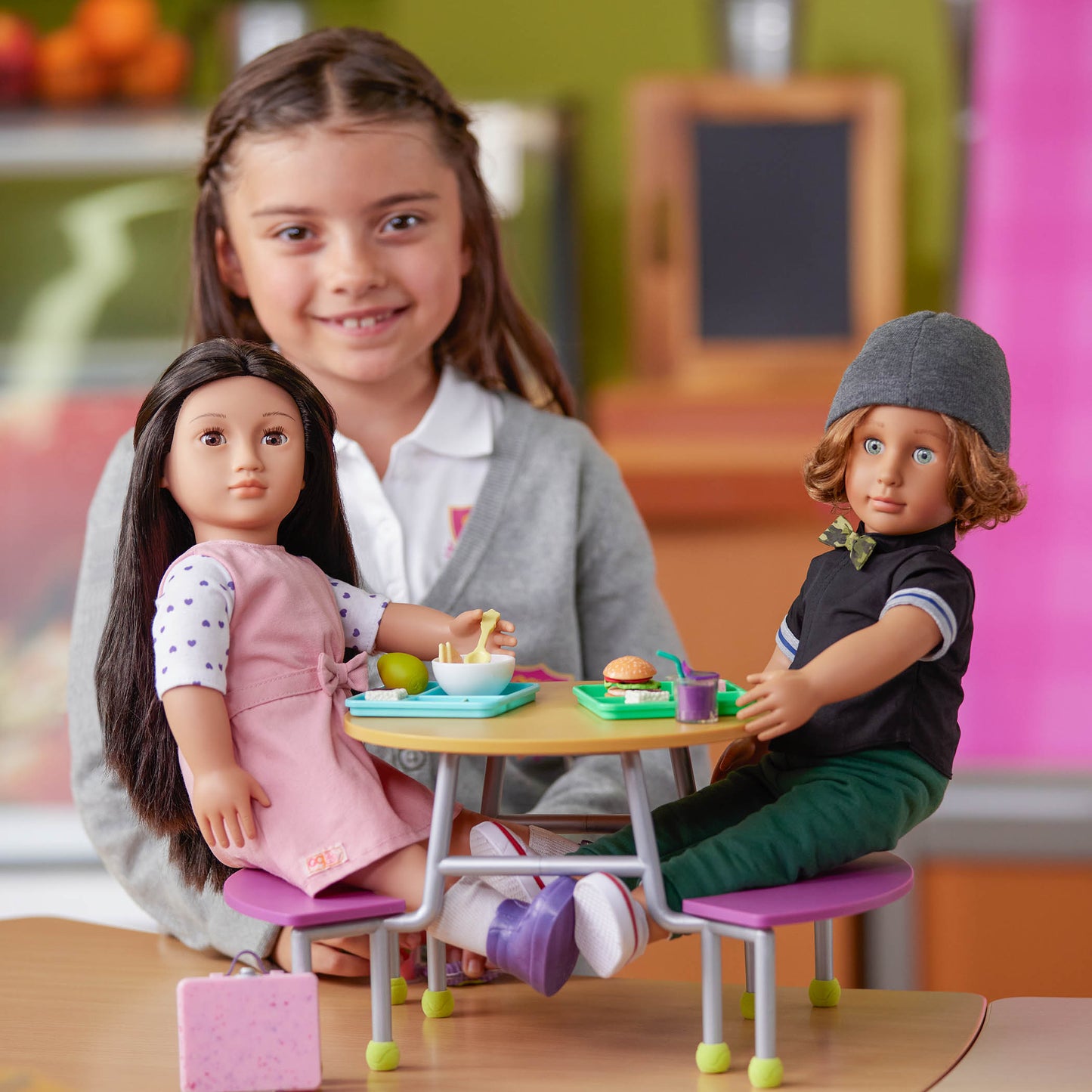 Child playing with the Our Generation Lin Deluxe School Doll