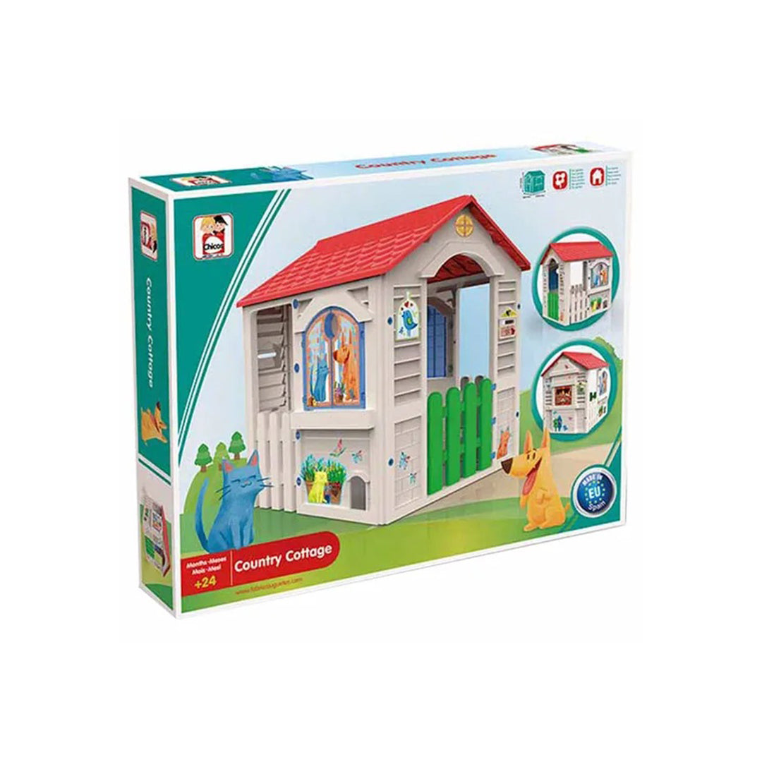 The Grand Cottage set up on a green lawn, showcasing its durability for outdoor use and how it serves as a focal point for garden fun.