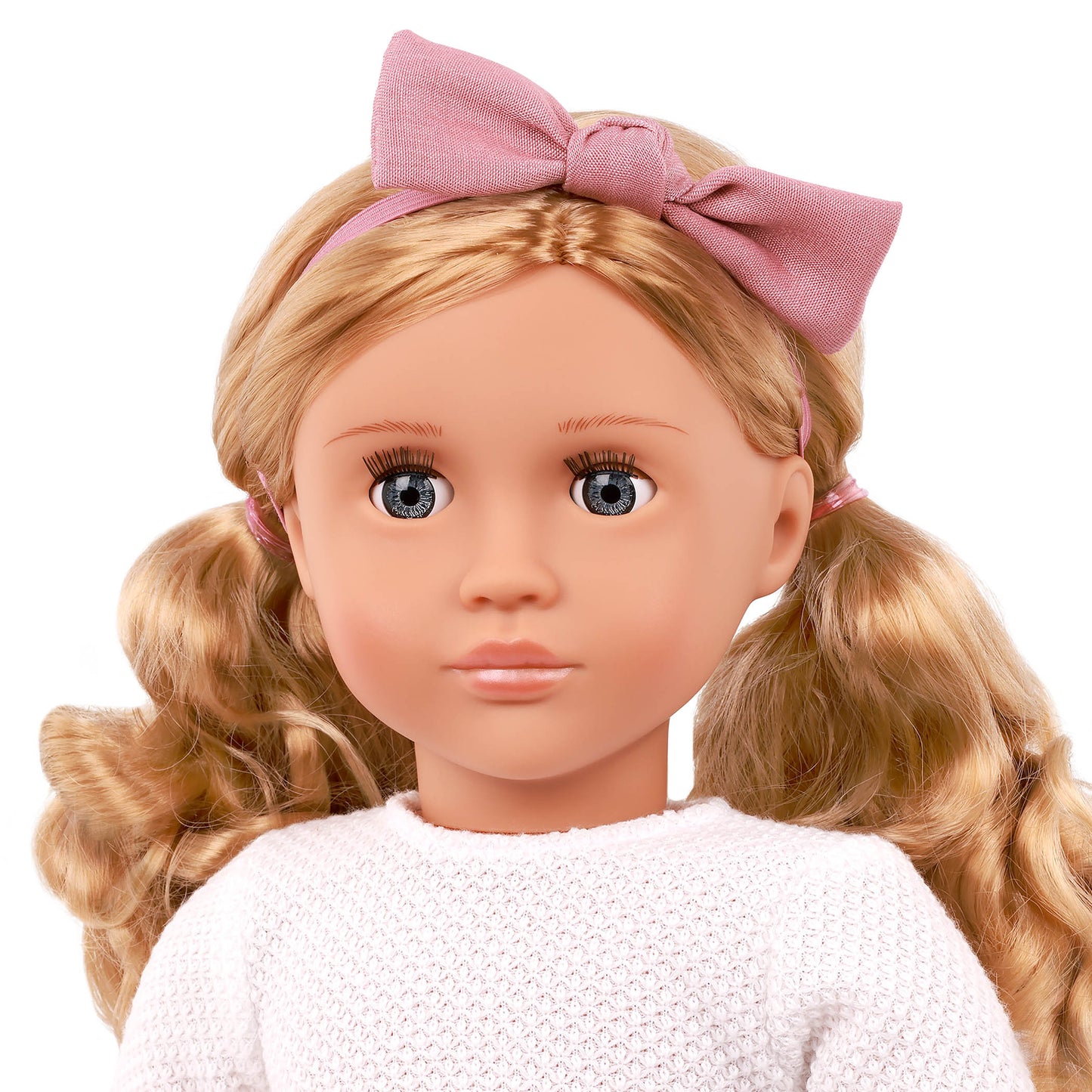 Close-up of the Effie Doll's pink frilly skirt outfit