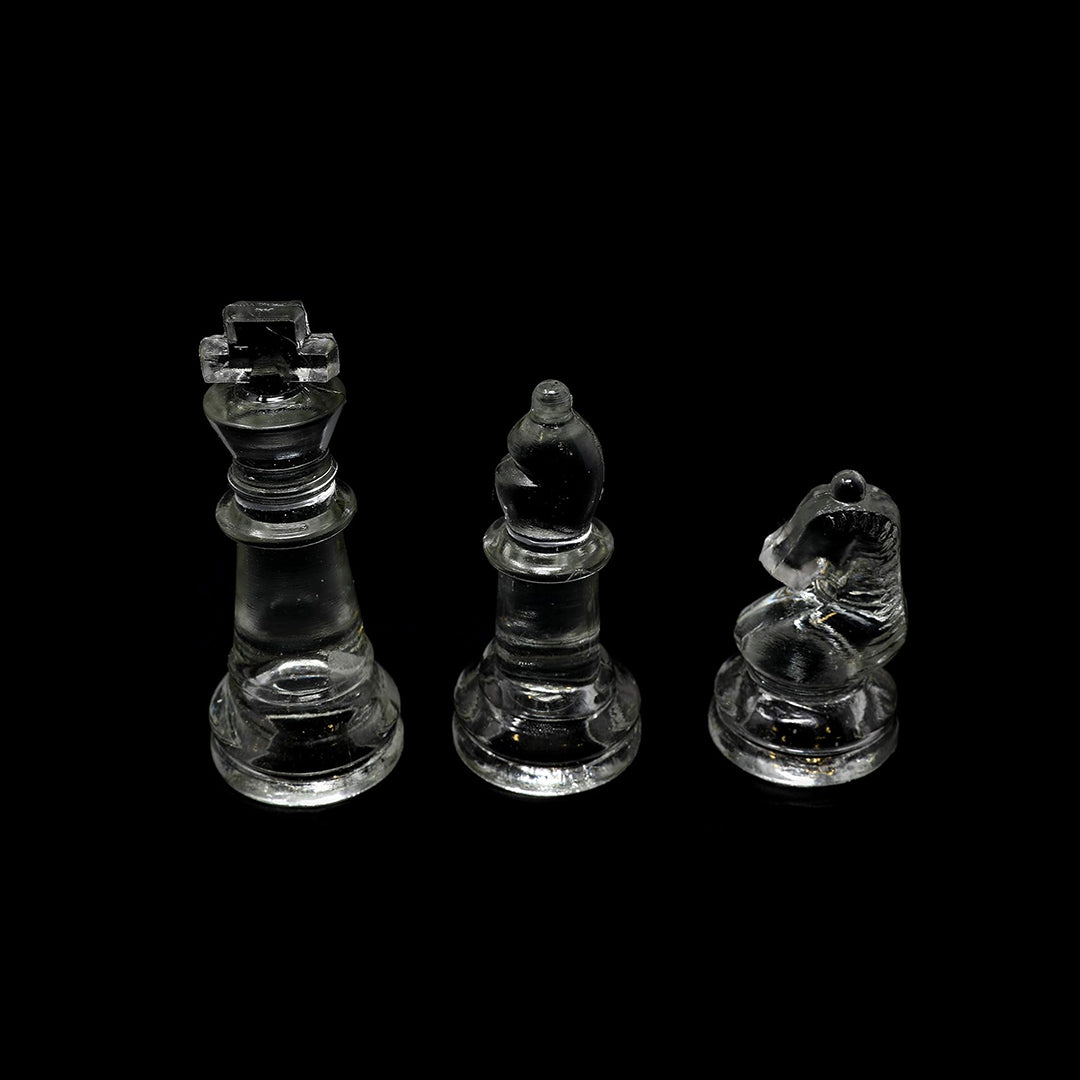 A close-up of a glass pawn with the soft felt padding on the bottom
