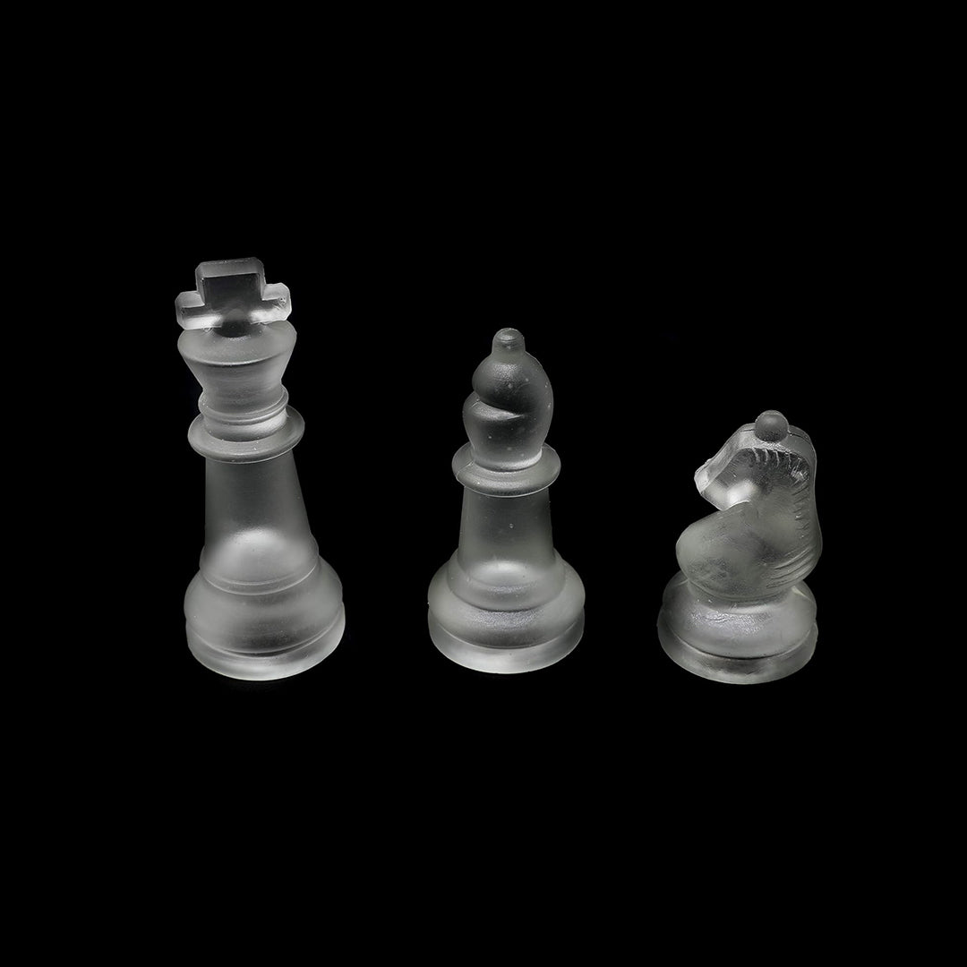 A chess game in progress on the elegant glass board
