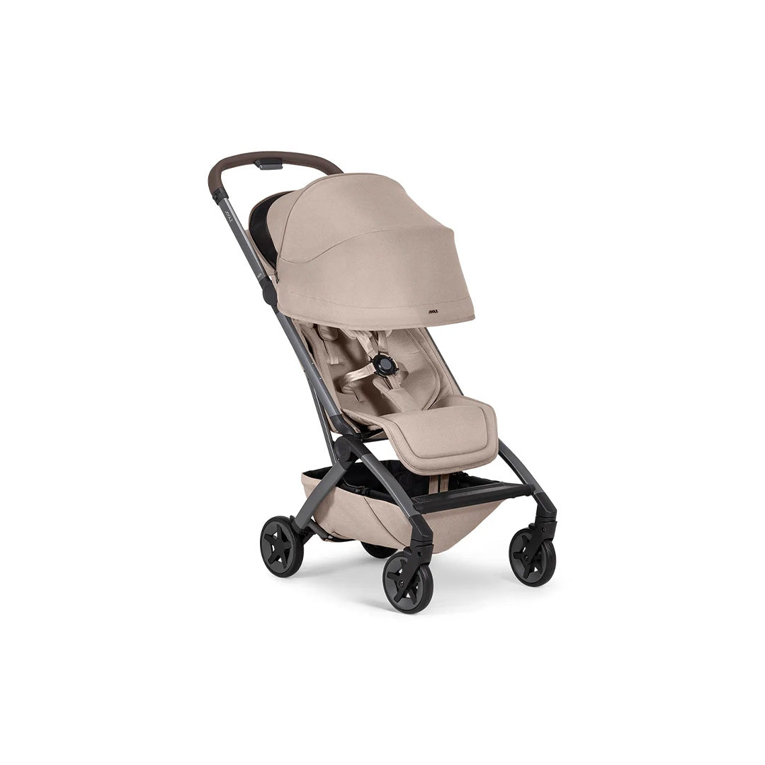 Close-up of the extended sun hood on the Sandy Taupe buggy, designed to provide enhanced shade and comfort for the child.