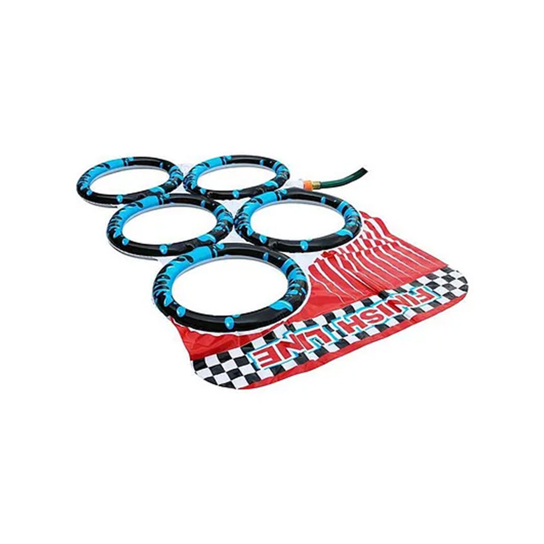 A view of the yellow inflatable hurdle placed on the slide, designed for children to leap over before hitting the water tubes.