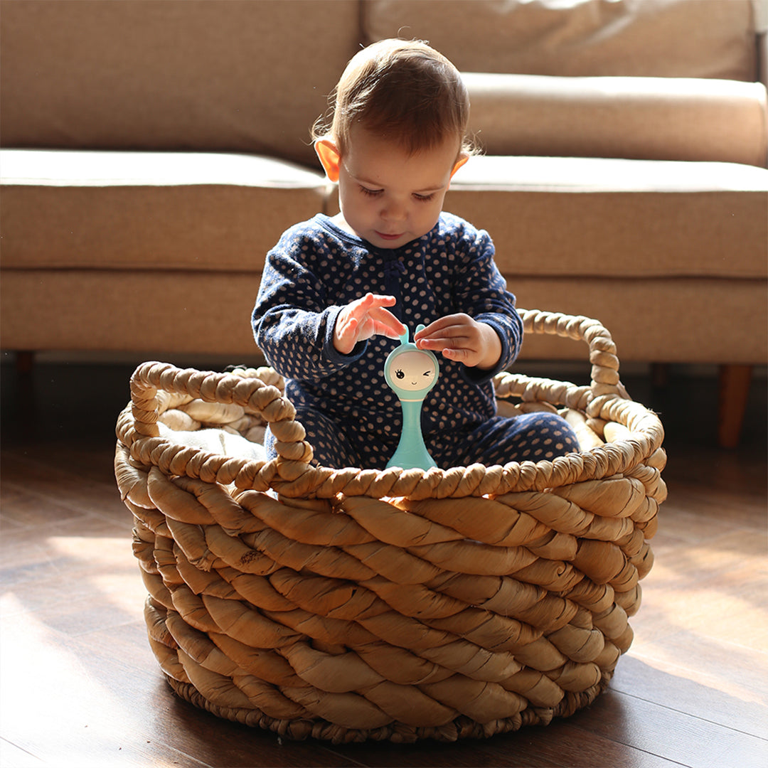 Child using color recognition cards to improve hand-eye coordination.
