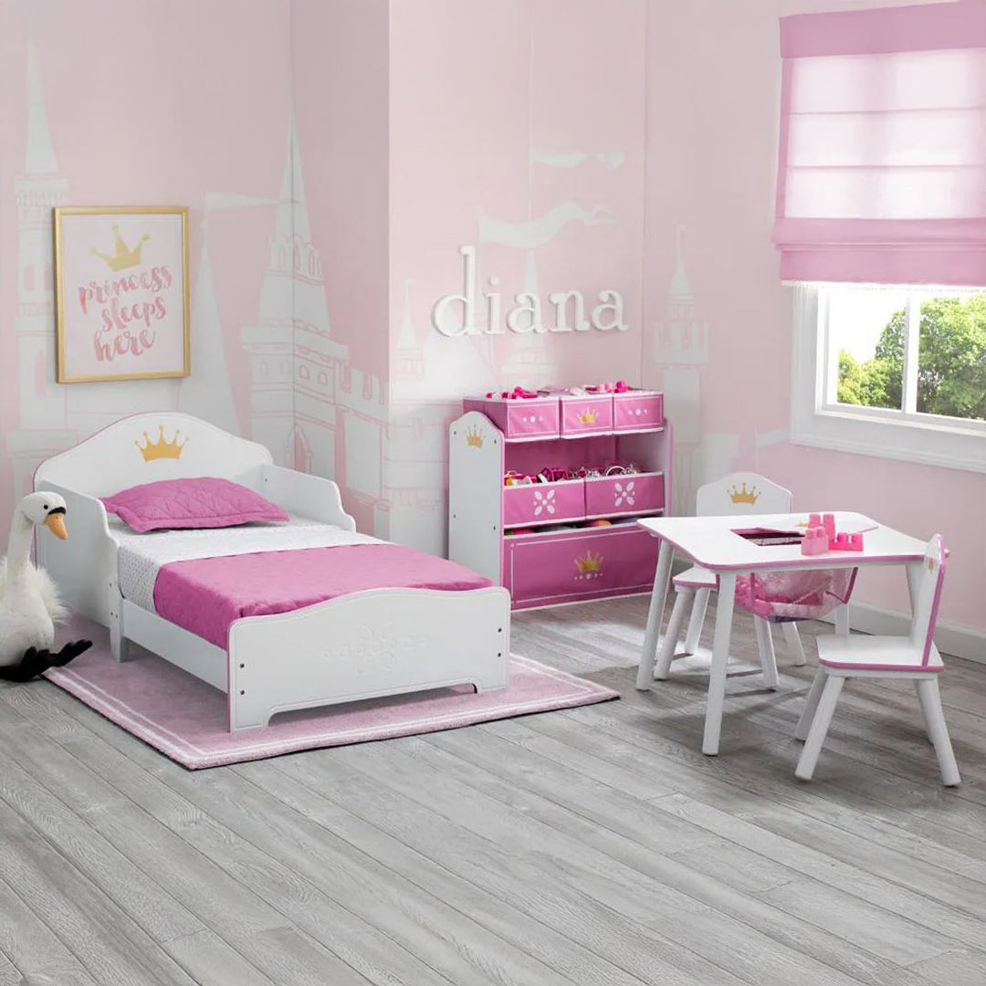 Delta Children pink and white wooden bed for screen-free play and rest.