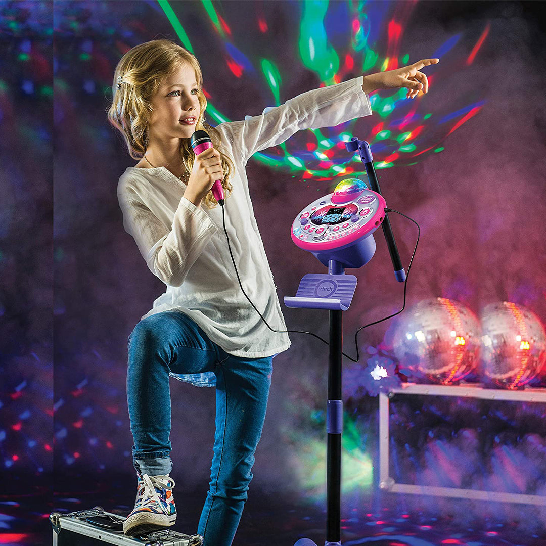 Child singing with motorized disco lights for sensory stimulation.
