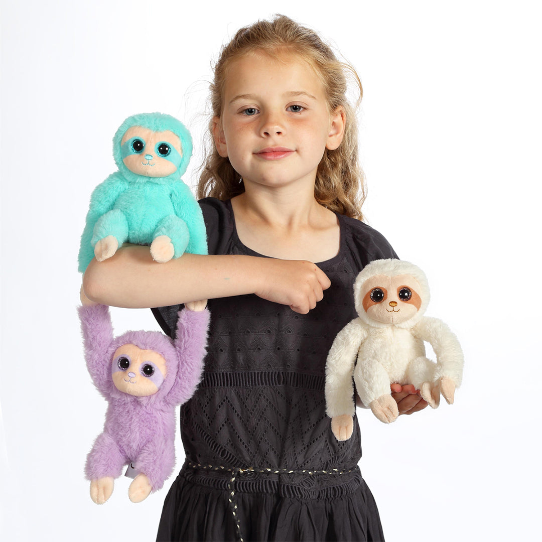 Child cuddling the Little Sloth Plush Toy