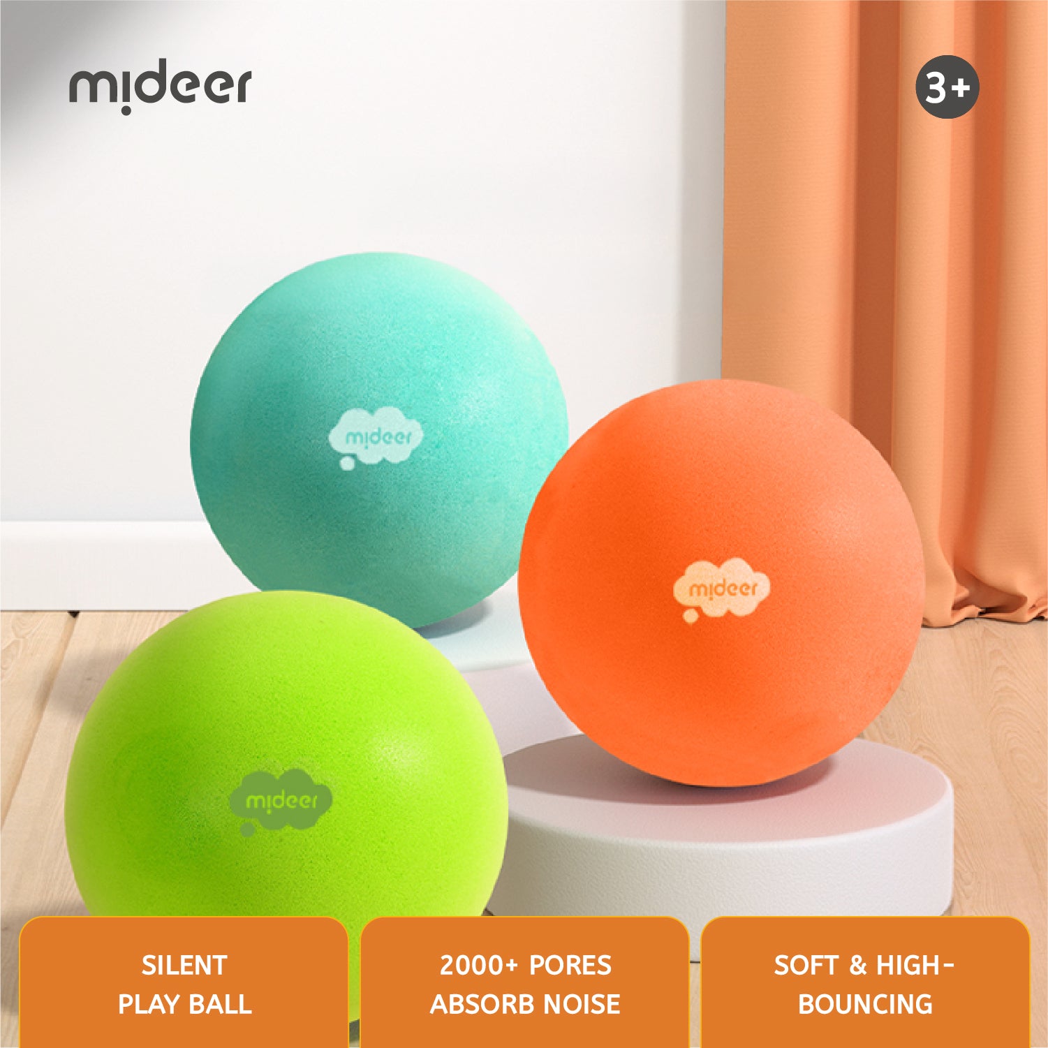 Three soft foam play balls in mint green, neon lime green, and bright orange, each printed with the middeer logo, displayed on white pedestals in an indoor setting with a peach curtain in the background. Three orange text banners at the bottom highlight product features: 'SILENT PLAY BALL', '2000+ PORES ABSORB NOISE', and 'SOFT & HIGH-BOUNCING'.