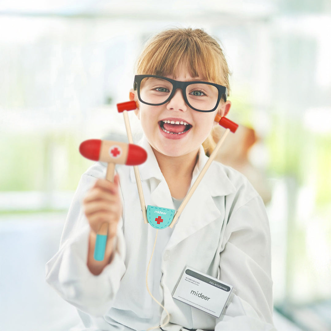 Montessori wooden stethoscope and toy syringe for active screen-free play.
