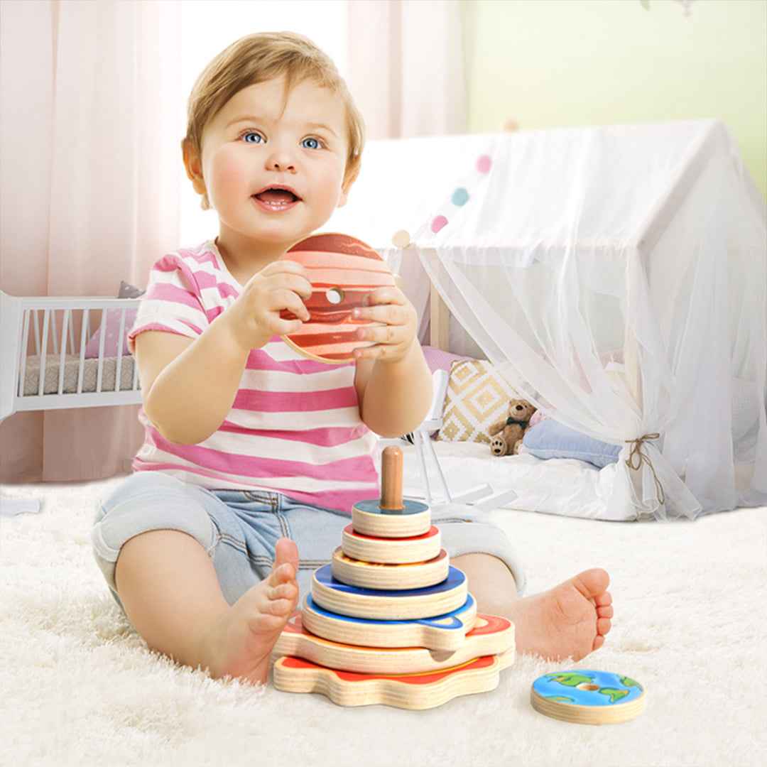 Montessori wood planet rings and central sun peg for active screen-free play.
