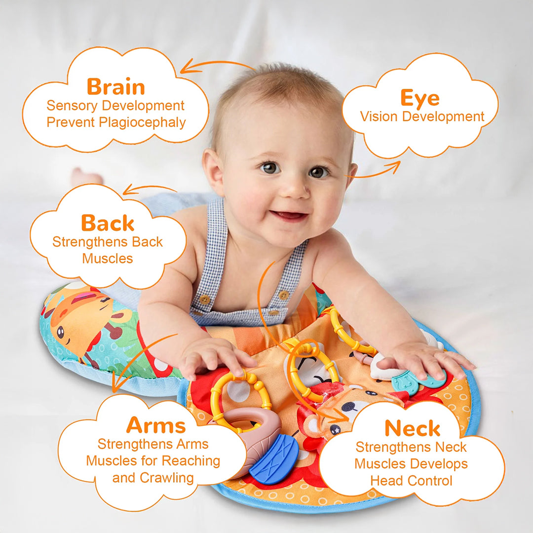 Infant engaging with the detachable musical lion on the tummy time pillow.