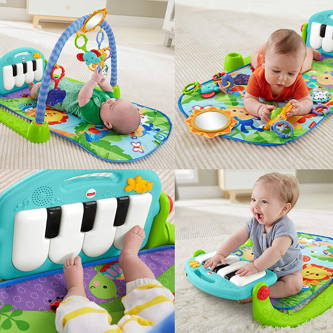 Baby reaching for the hanging toys on the Fisher-Price Kick 'n Play Piano Gym
