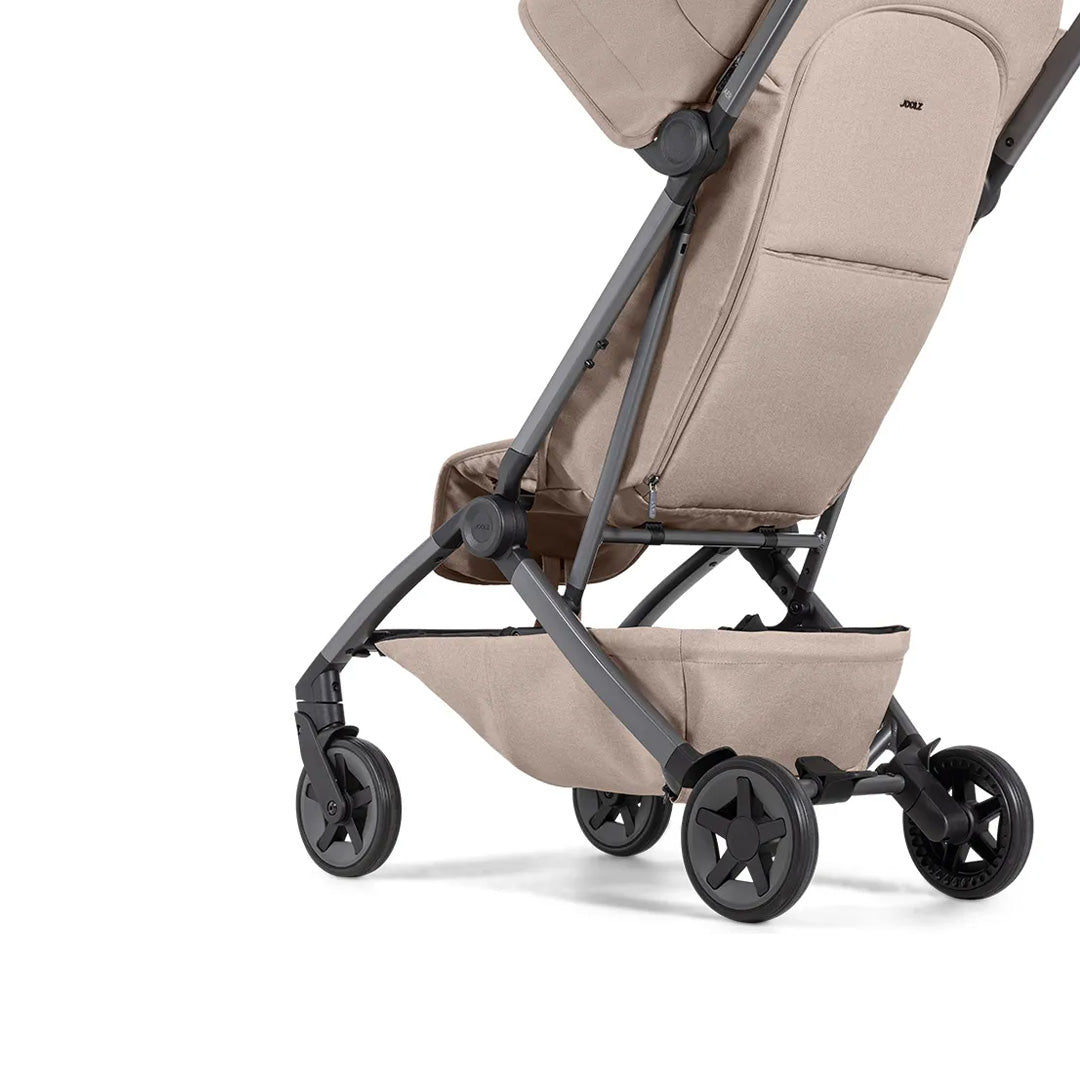 Action shot demonstrating the one-hand fold mechanism, showing how quickly and easily the stroller collapses for parents on the go.