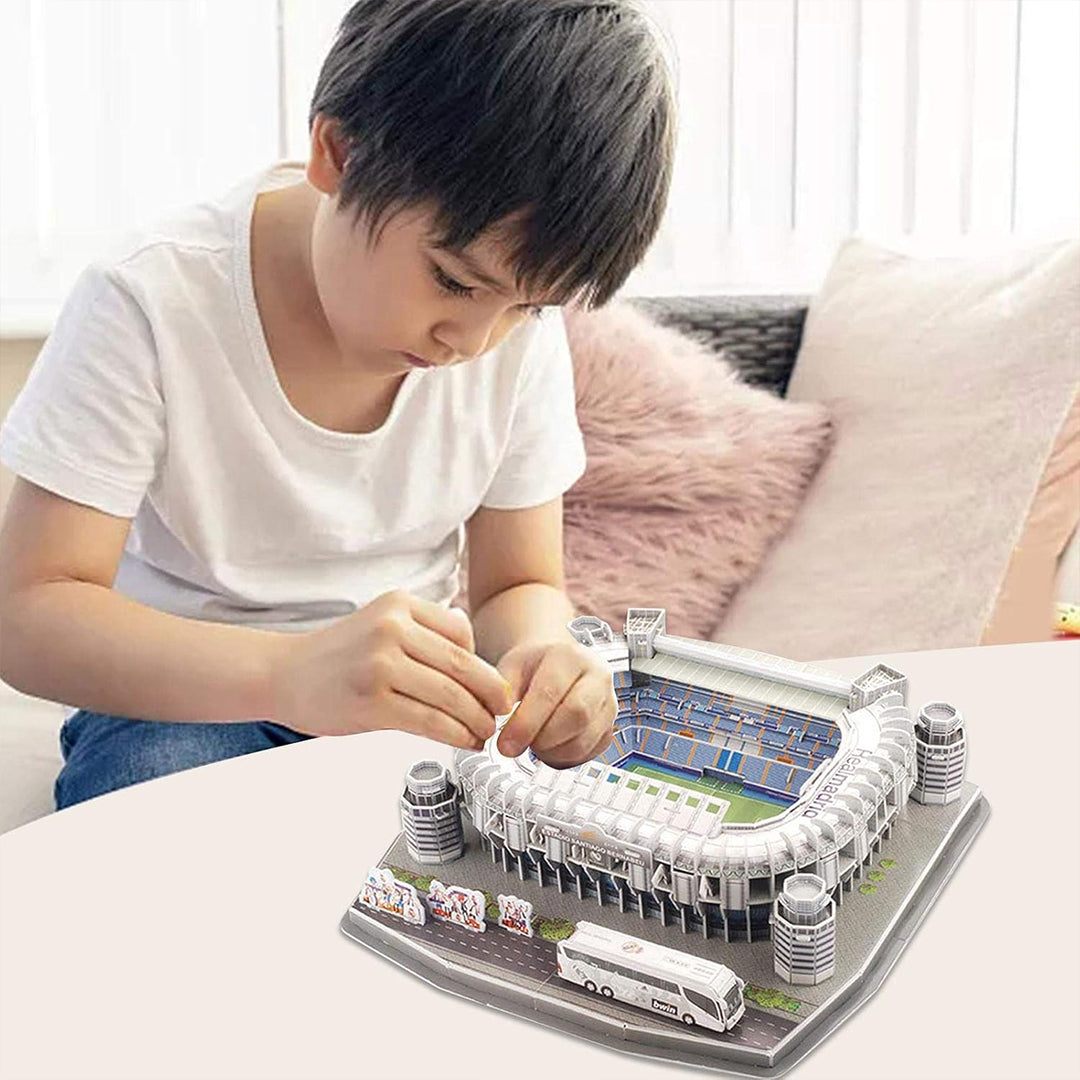 Real Madrid fan assembling the Santiago Bernabeu 3D puzzle.