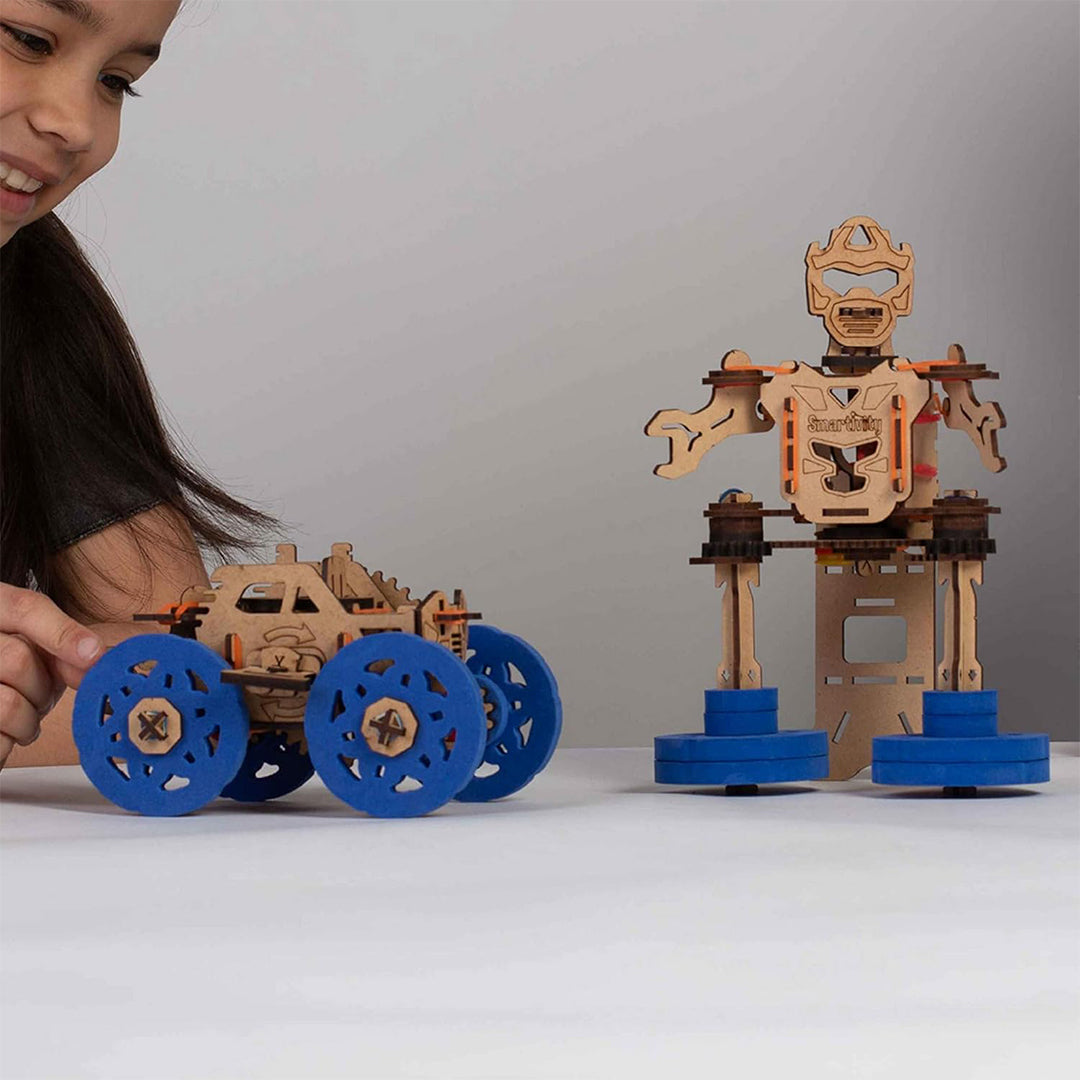 A child assembling the different parts of the toy with the instruction manual
