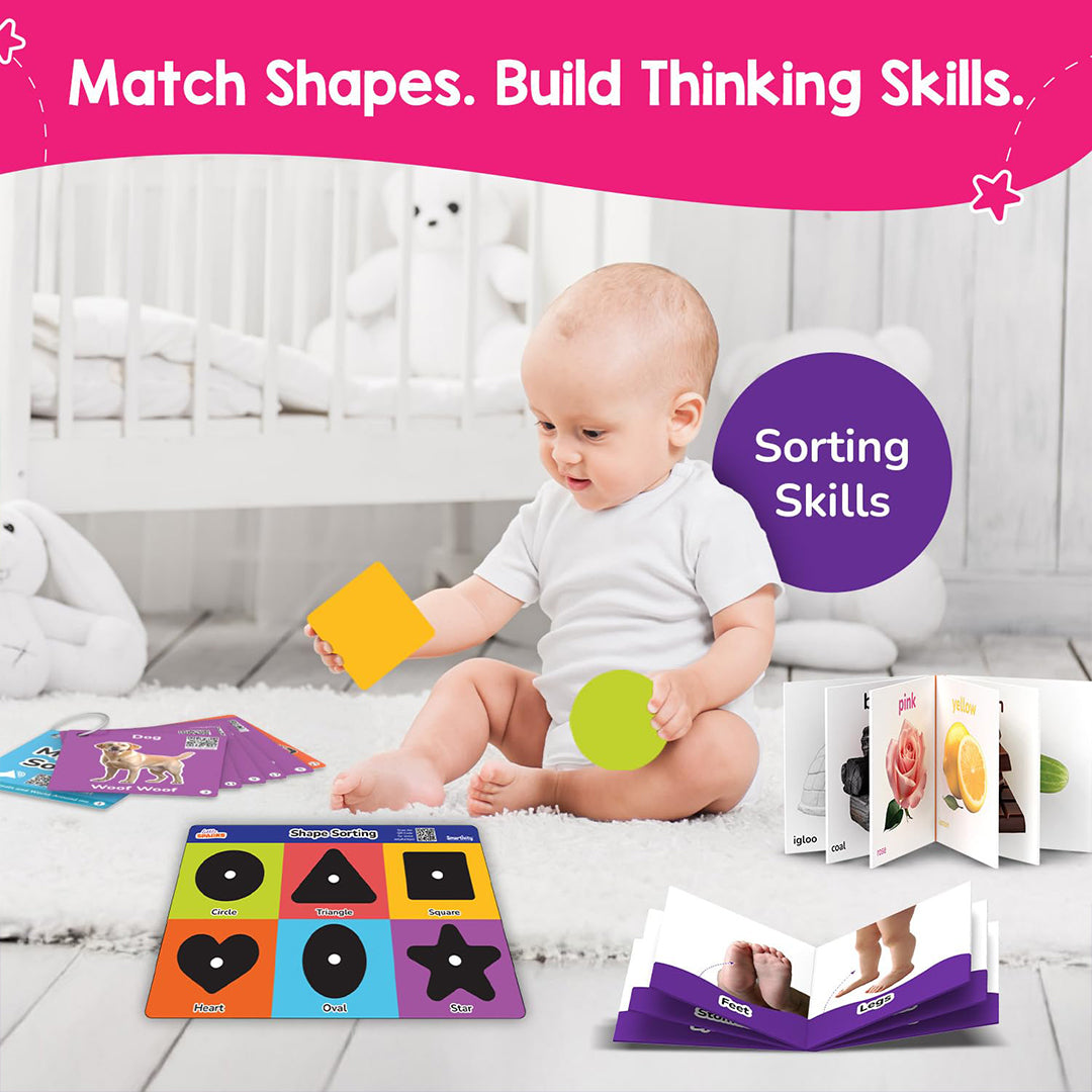 A child looking at the board book on colors
