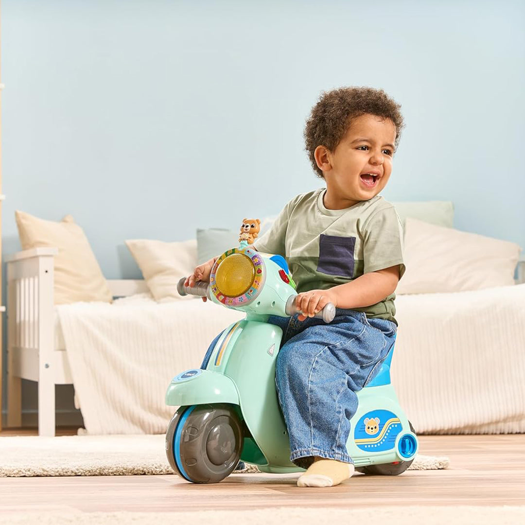 Child Pressing Buttons on VTech Scooter tricycle for Road Safety Phrases

