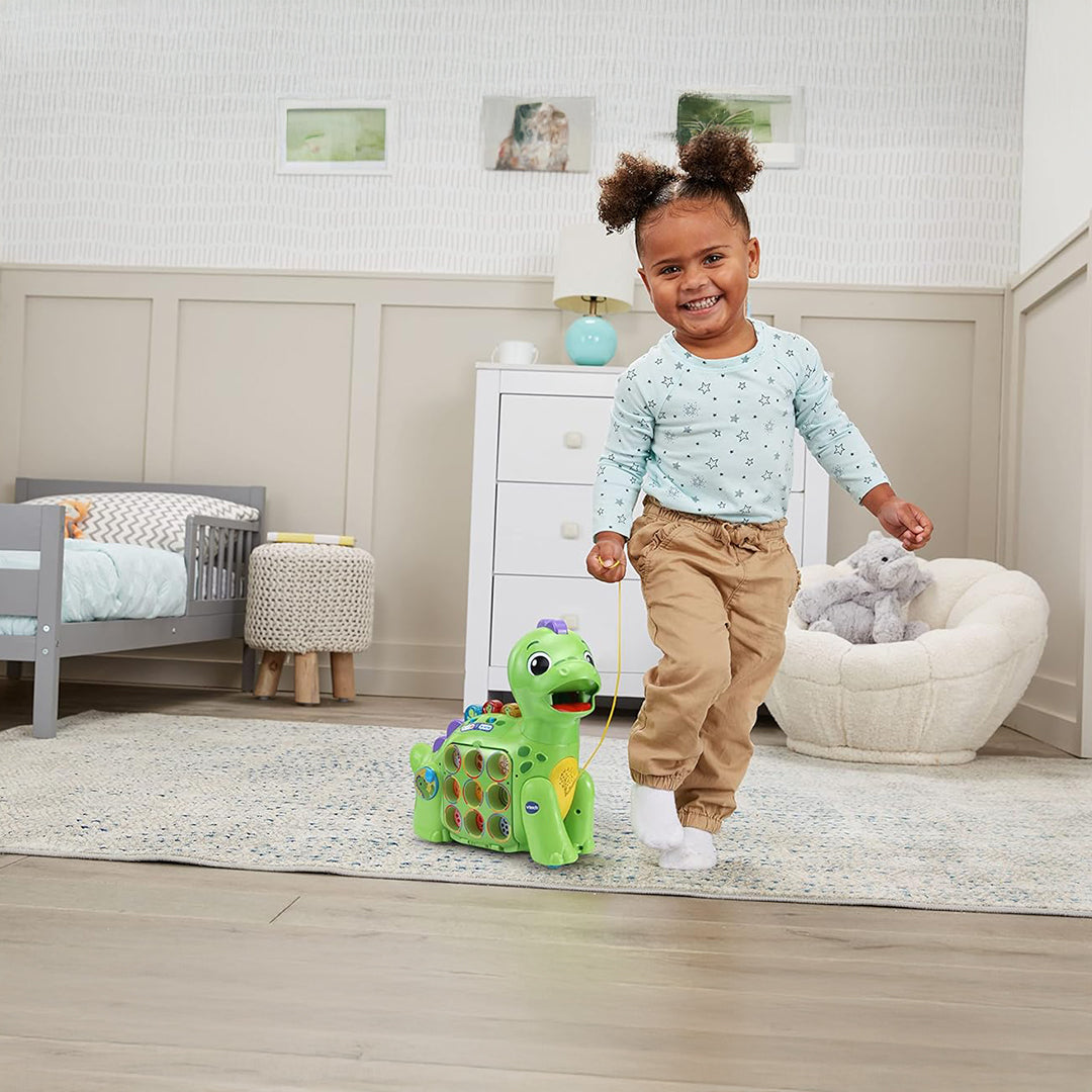 Child Playing with Interactive VTech Dinosaur Learning Toy