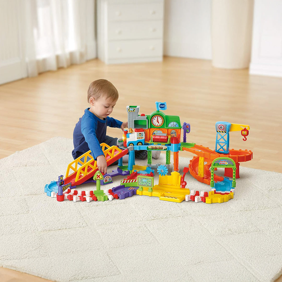 Child Playing with Interactive Train Station and Crane
