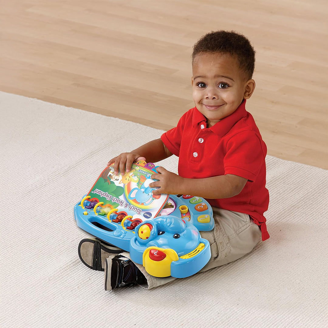 Child Learning Numbers and Animals with VTech Elephant Book