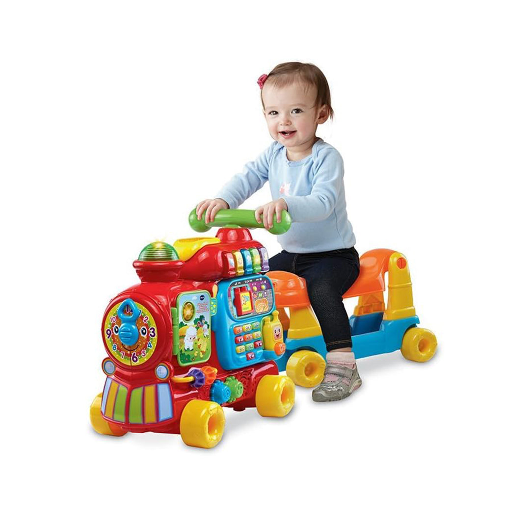 Toddler Playing with Stackable Letter Blocks on VTech Train Wagon
