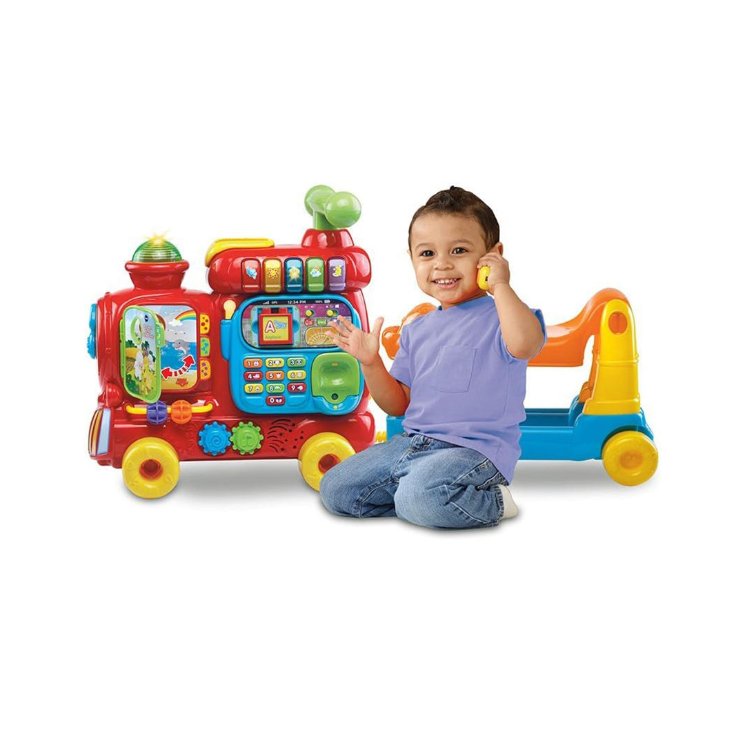 Toddler Playing with Stackable Letter Blocks on VTech Train Wagon