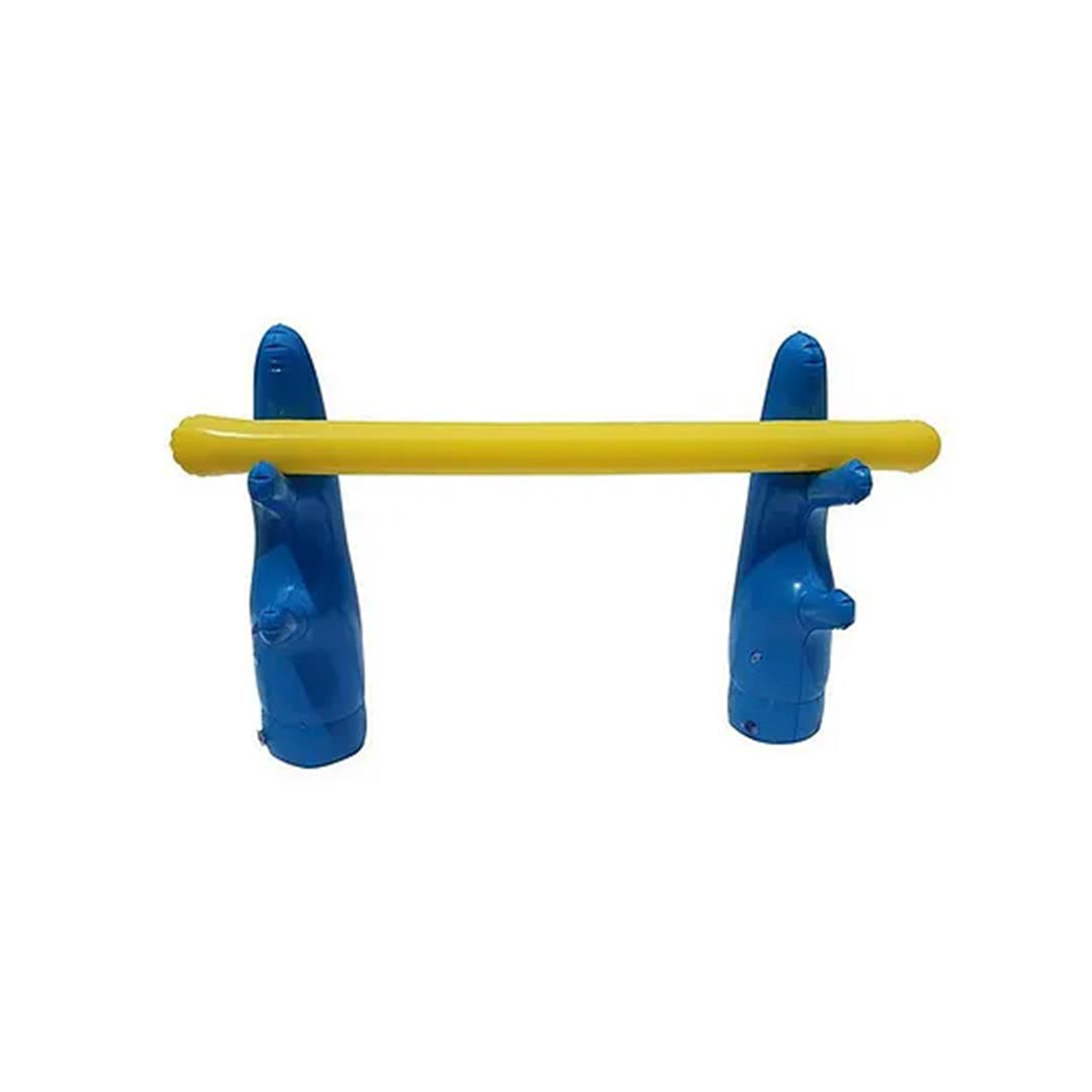 Close-up of the inflatable tire jump feature, showing water spraying from the sprinkler rim as a child prepares to dive through it.