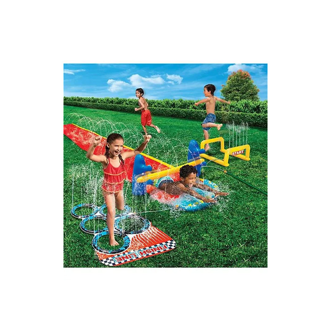 The end section of the obstacle course featuring the red and blue inflatable limbo posts and bar, challenging kids to slide low to finish the race.