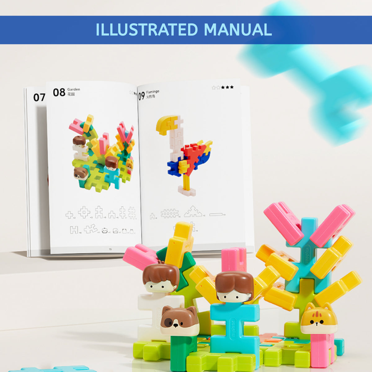 An illustrated construction toy manual shown open behind colorful assembled toy figures and coral-like structures. The top of the image has a blue banner reading 'ILLUSTRATED MANUAL'.